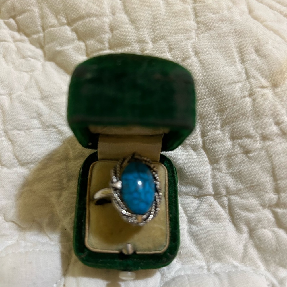 Costume jewelry ring. Faux turquoise. Adjustable band. Ornate edges. Quick ship.